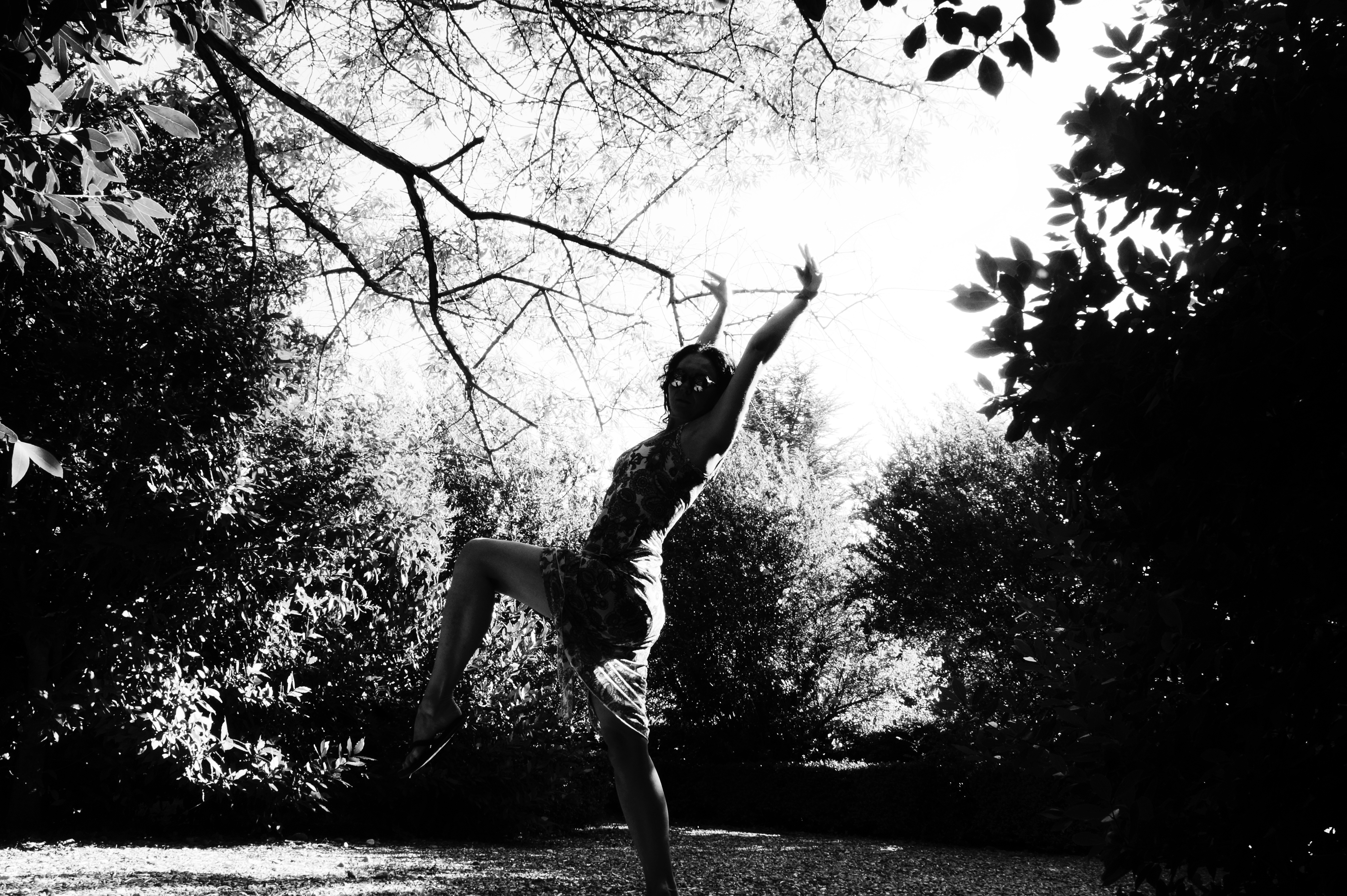 Woman dancing in a garden